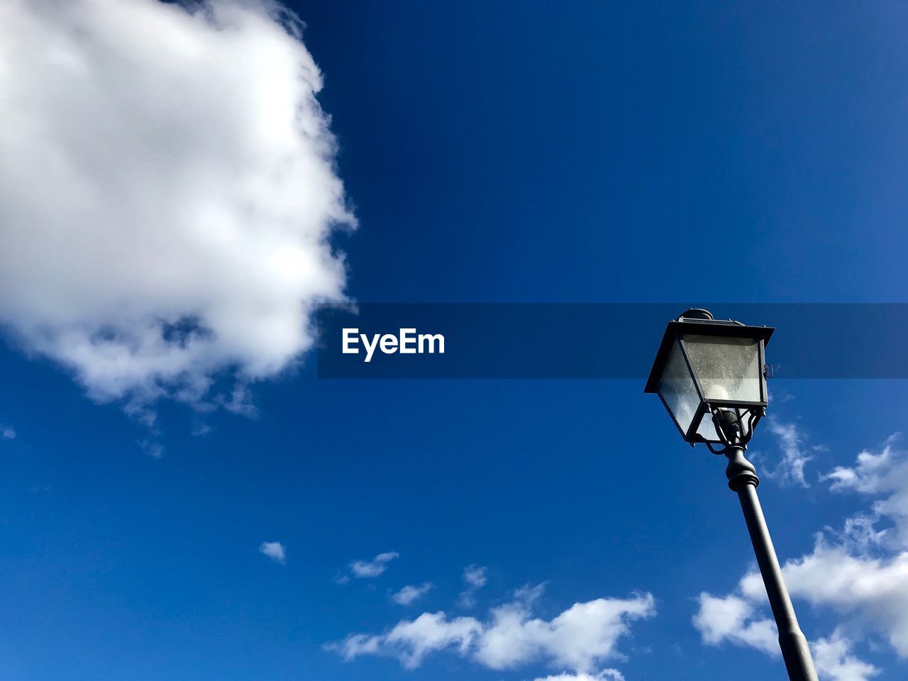 Low angle view of street light against sky