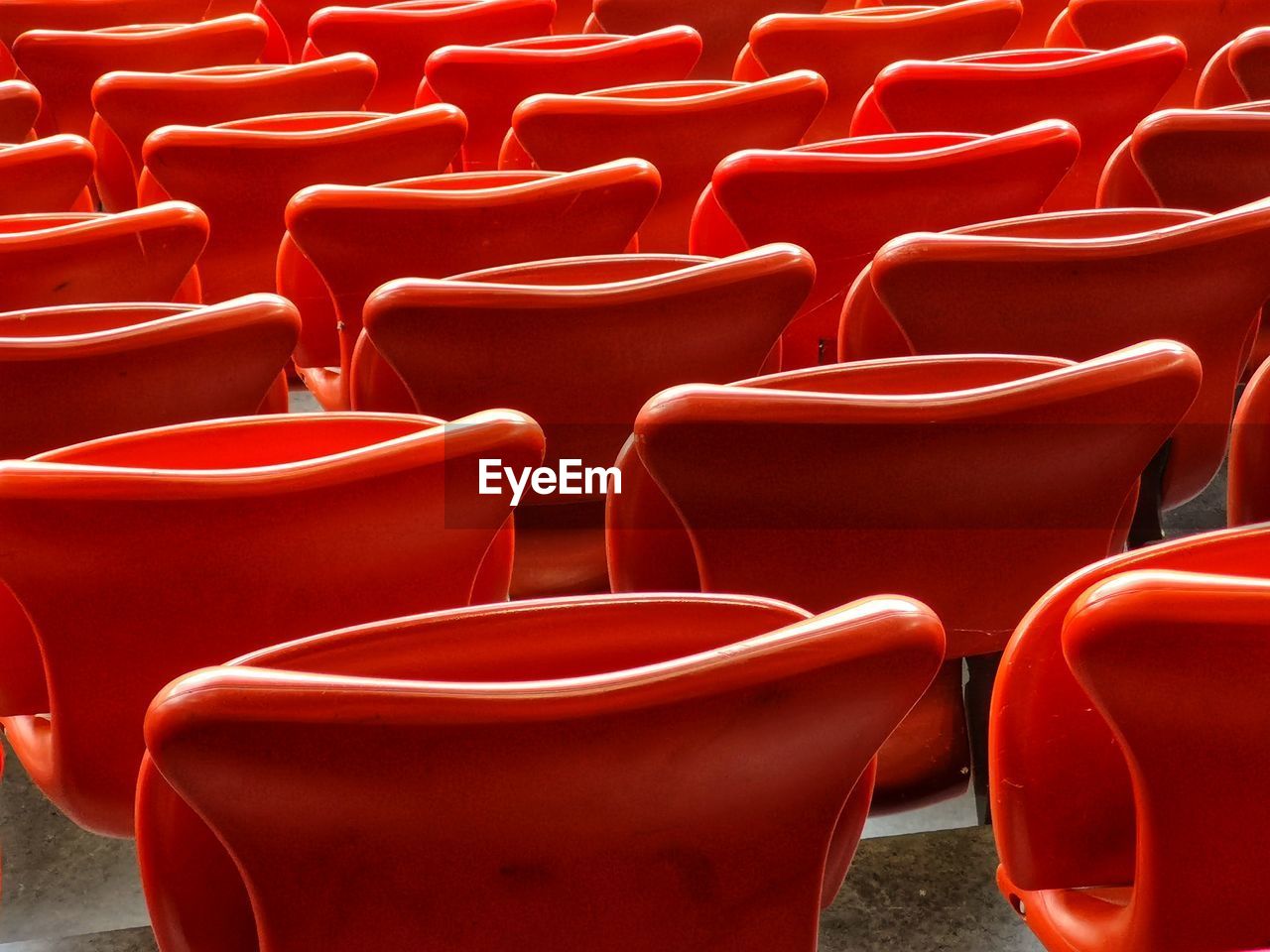 Full frame shot of red empty chairs