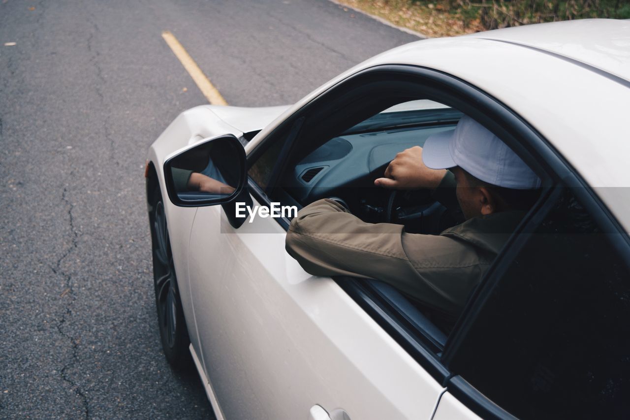 Man driving car on road