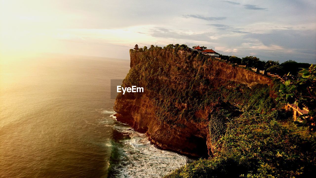 Scenic view of sea against cloudy sky