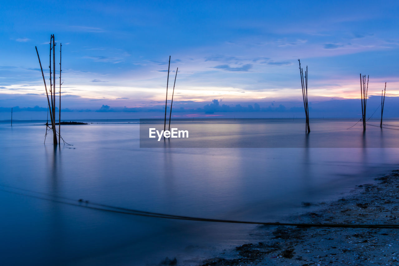 Scenic view of sea against sky at sunset