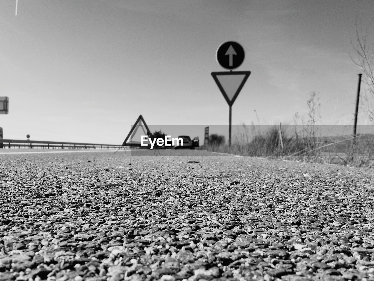 ROAD SIGNAL AGAINST CLEAR SKY