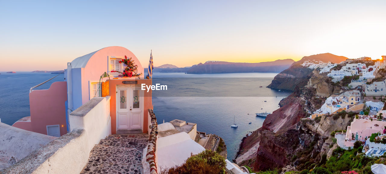 Santorini panorama.traditional white cave houses on a cliff on the island santorini, greece