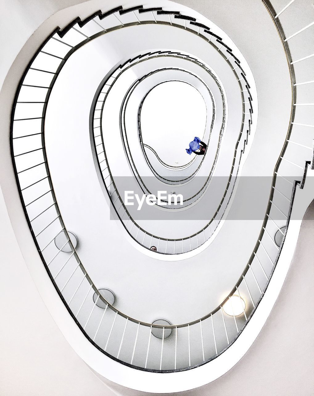 Directly below shot of spiral staircases in building