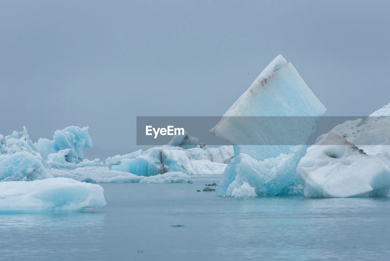 Floating icebergs in jokulsarlon glacial lagoon, iceland. global warming