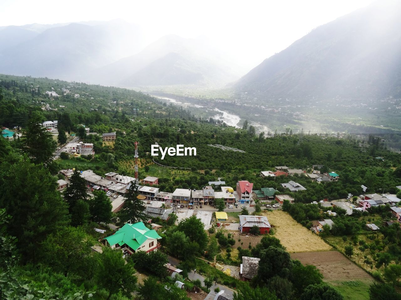 High angle view of townscape and houses against mountains