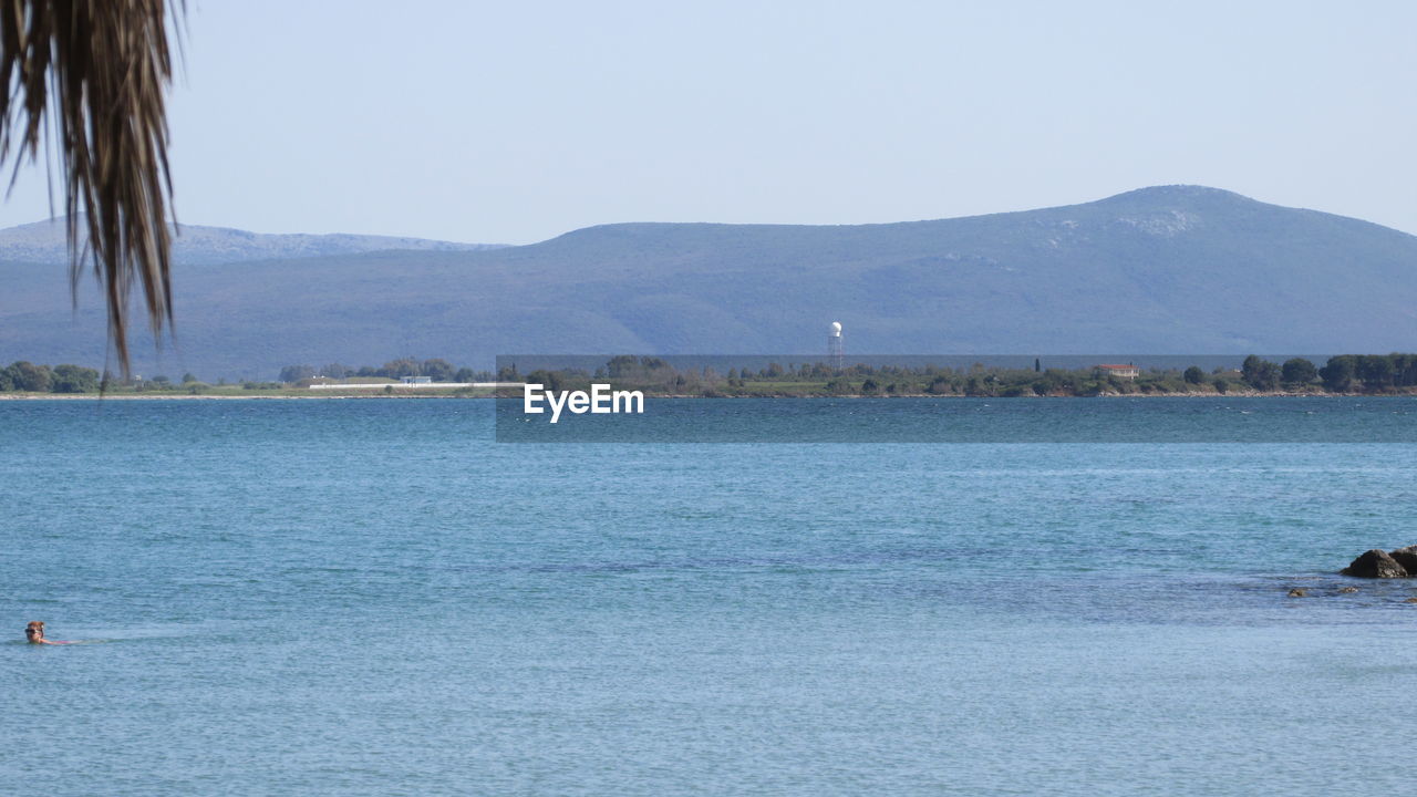 SCENIC VIEW OF MOUNTAINS AND SEA