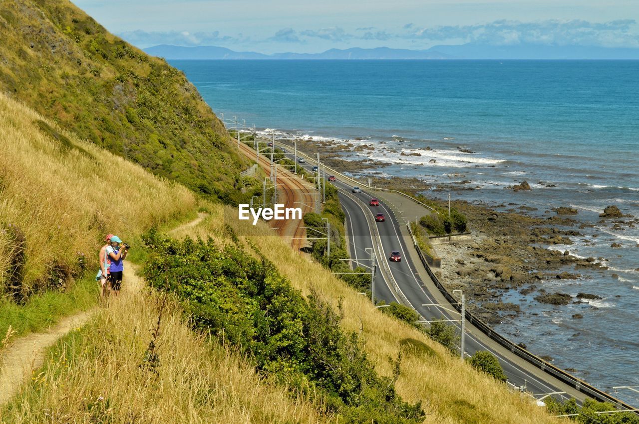 People riding on sea shore