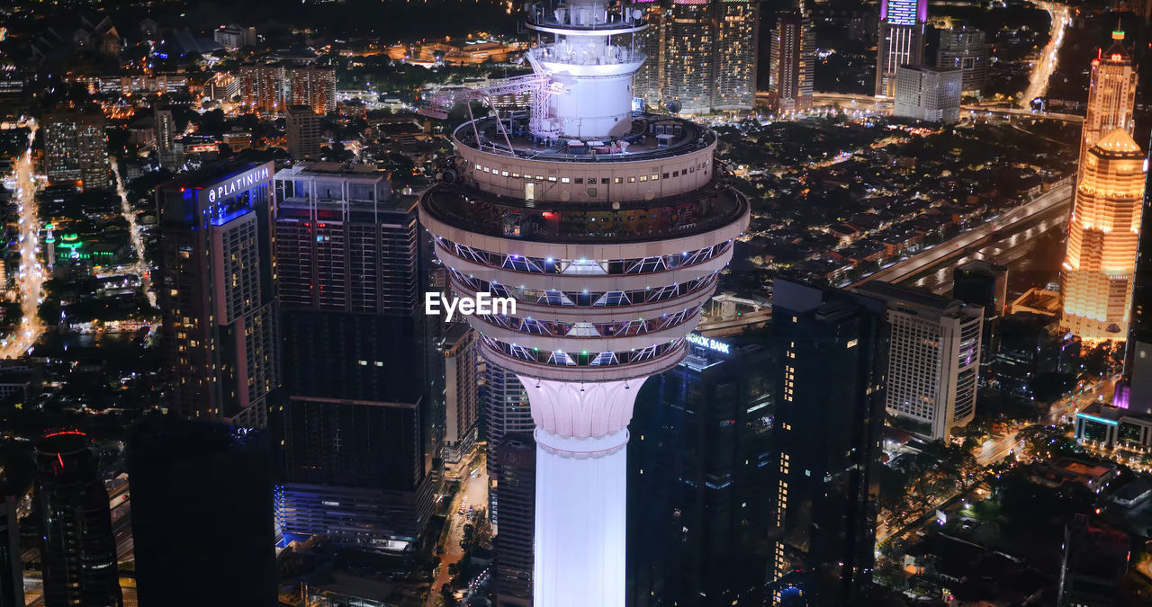 High angle view of buildings in city at night