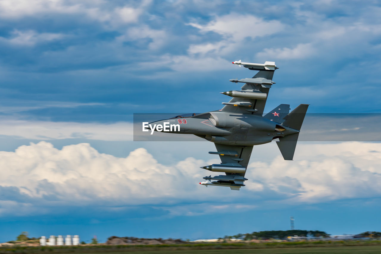 LOW ANGLE VIEW OF AIRPLANE AGAINST SKY