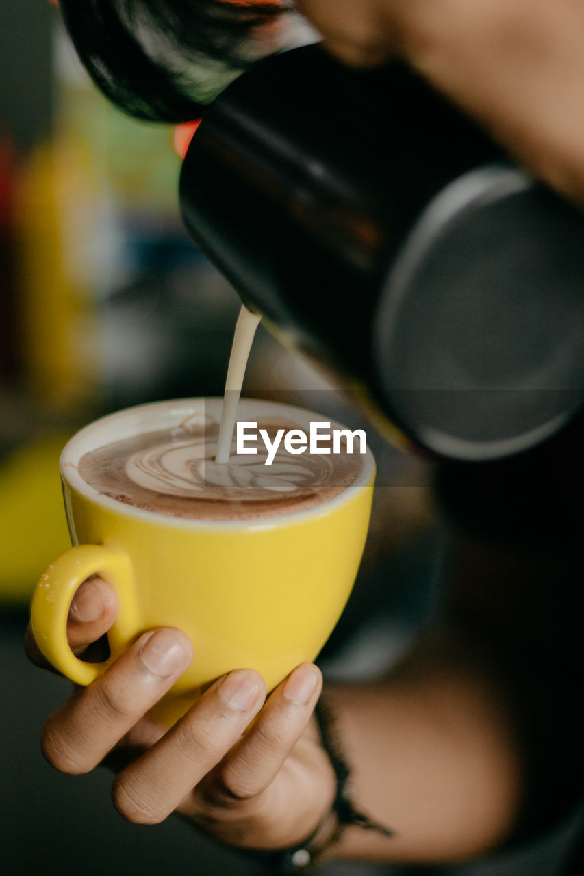 Making a coffee latte in the bar