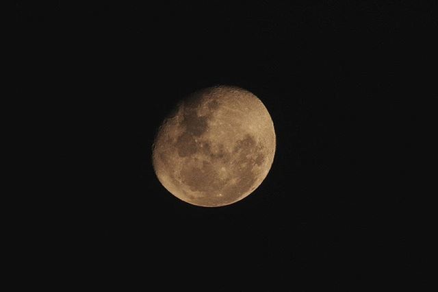 LOW ANGLE VIEW OF MOON IN SKY