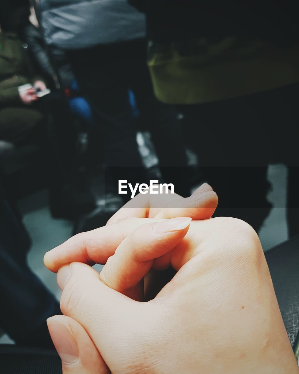 Couples holding hands in subway in seoul, south korea