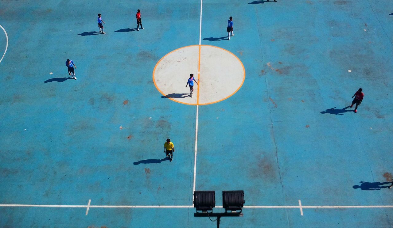 High angle view of young people playing soccer 