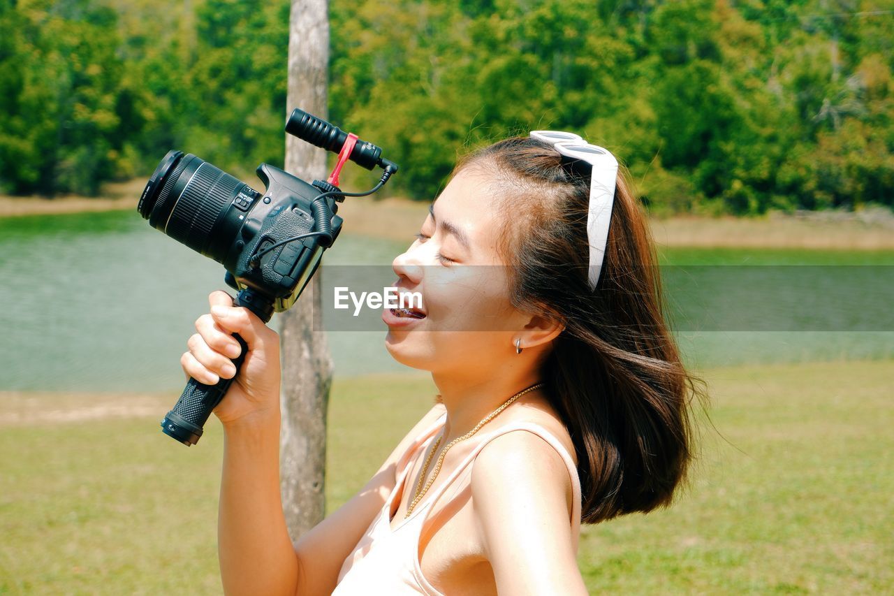 Portrait of young woman looking at camera