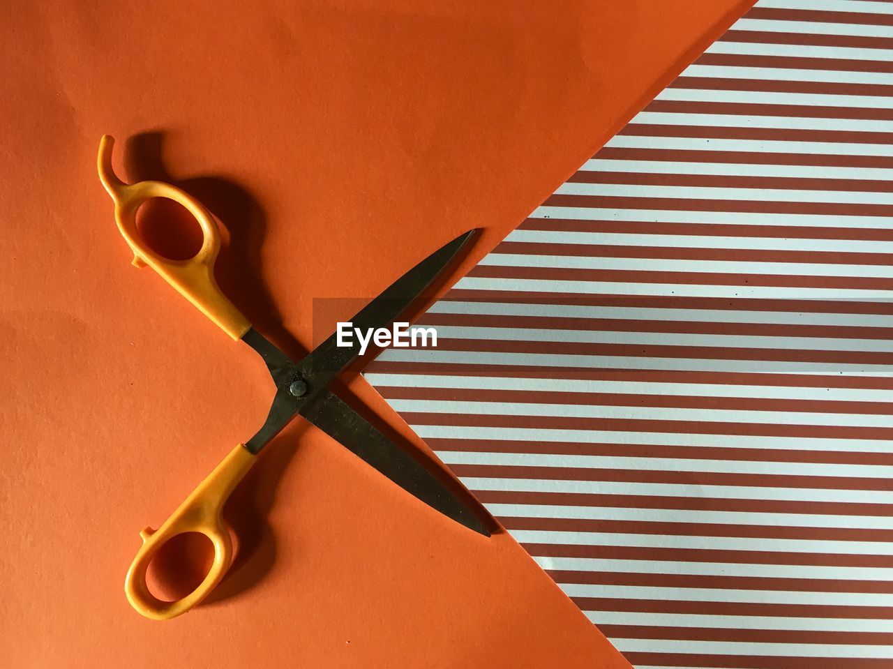 Directly above shot of scissors on table