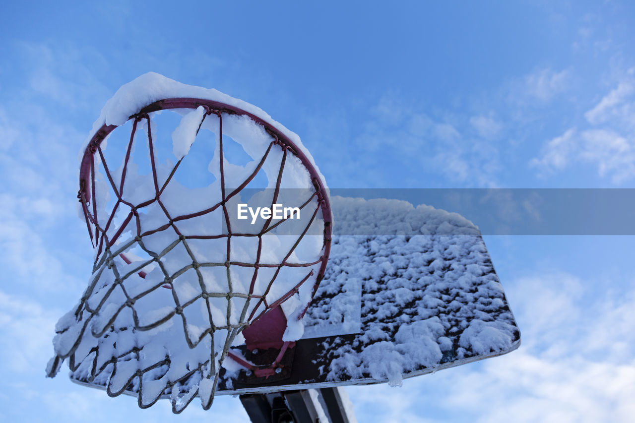 LOW ANGLE VIEW OF BASKETBALL HOOP