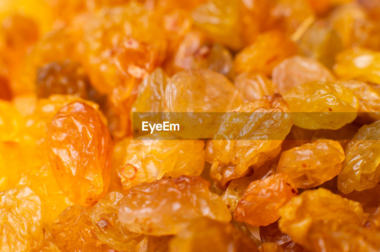 food, food and drink, plant, healthy eating, fruit, wellbeing, dried fruit, freshness, produce, snack, orange color, sweet food, dried food, no people, close-up, large group of objects, backgrounds, full frame, candied fruit, indoors, raisin, heap, abundance, organic, sweet, yellow