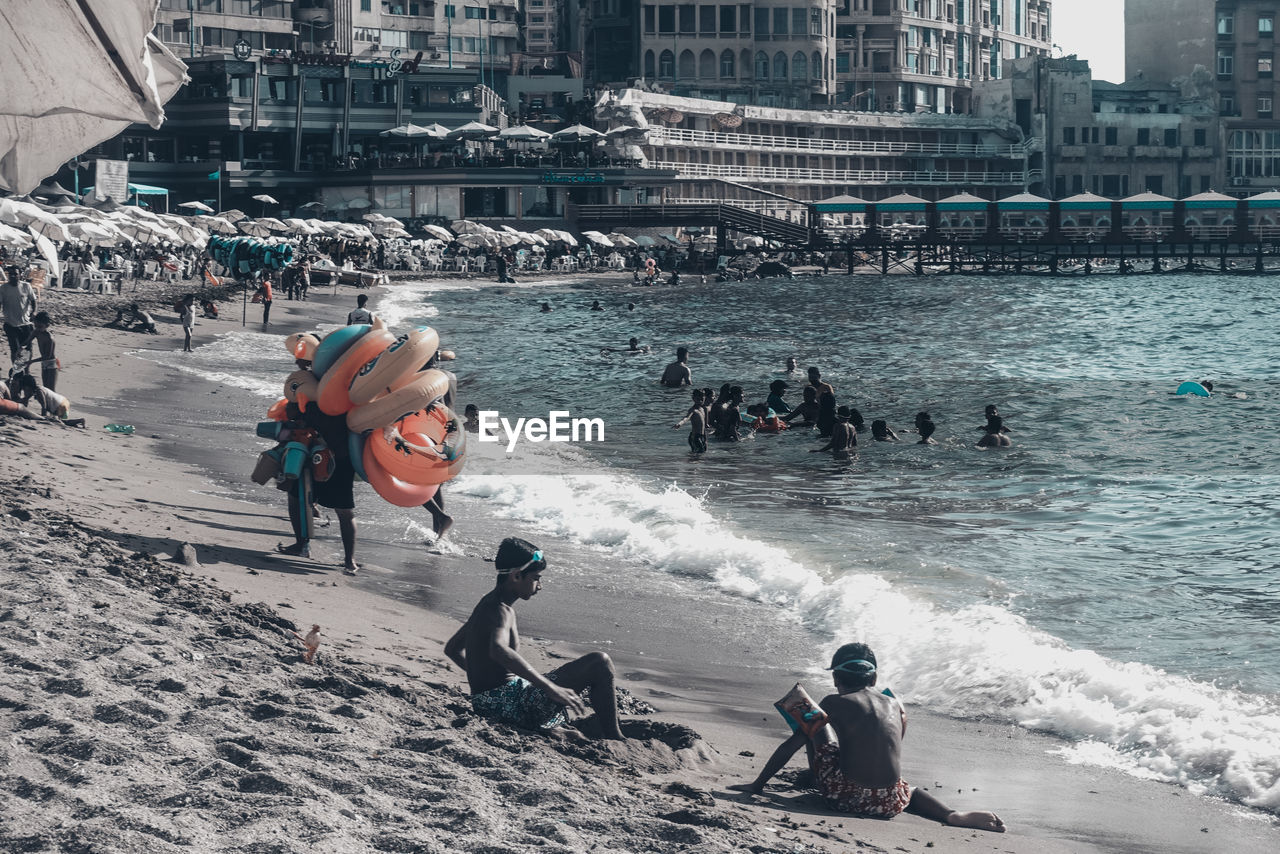 MEN ON BEACH