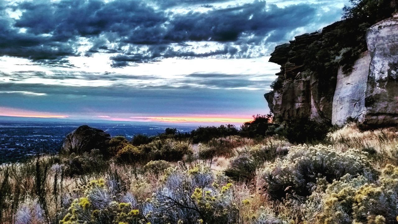 Scenic view of landscape against cloudy sky