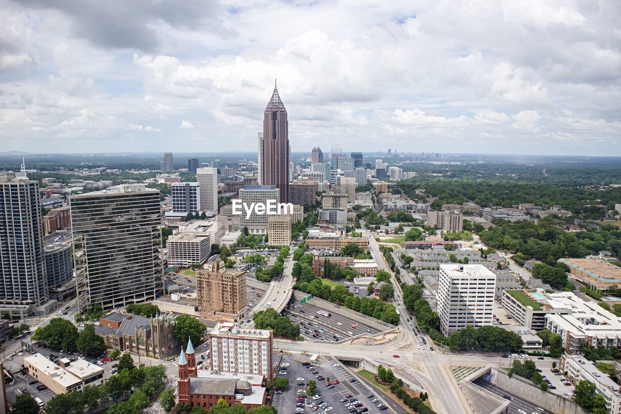 High angle view of buildings in city against sky