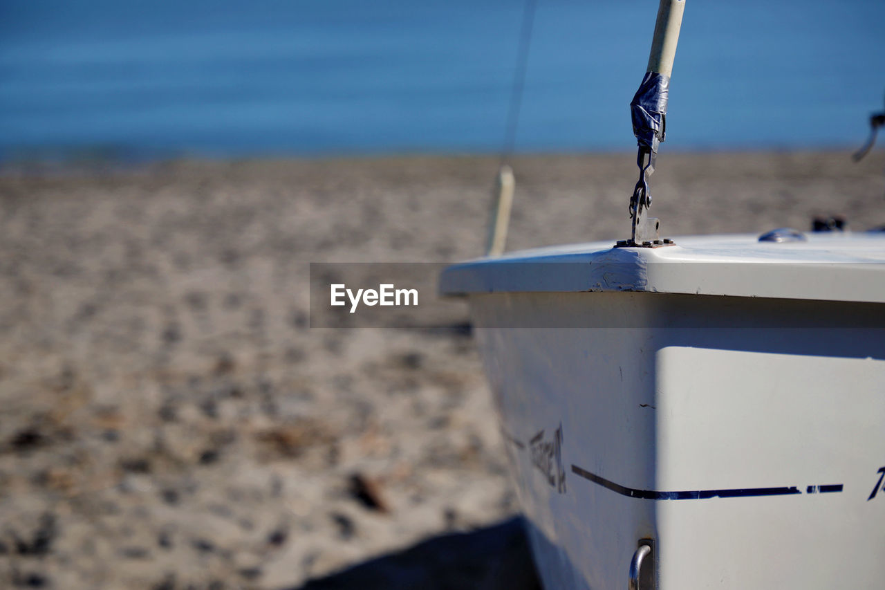 Beach Blue Boat Close-up Container Day Detail Environment Focus On Foreground Garbage Bin Horizon Land Motion Nature No People Outdoors Sailing Sand Sea Selective Focus Ship Sky Sport Water