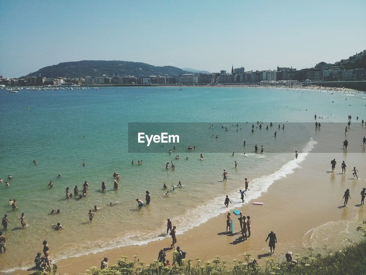 View of crowded beach on sunny day