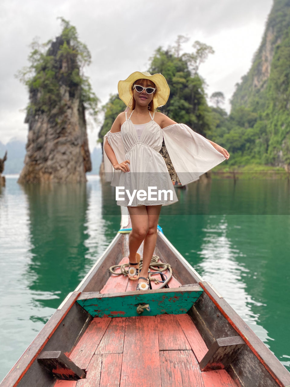 Portrait of woman standing in boat