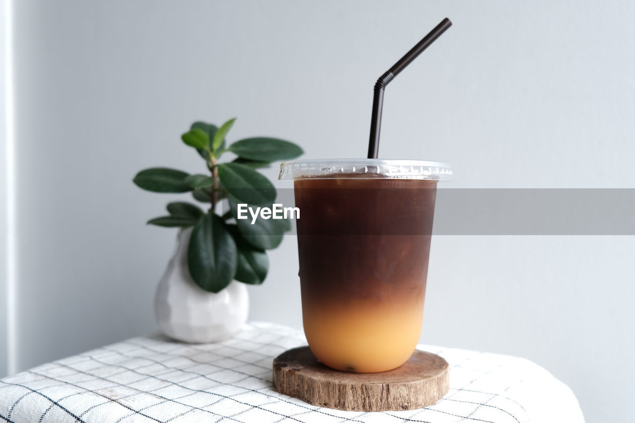 CLOSE-UP OF DRINK WITH GLASS OF COFFEE