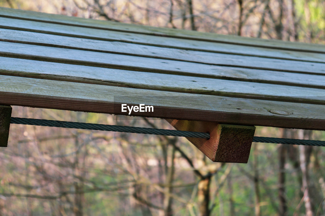 CLOSE-UP OF EMPTY BENCH