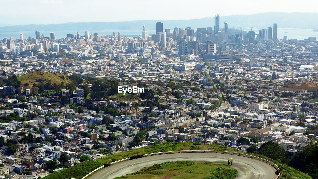 High angle view of modern buildings in city against sky