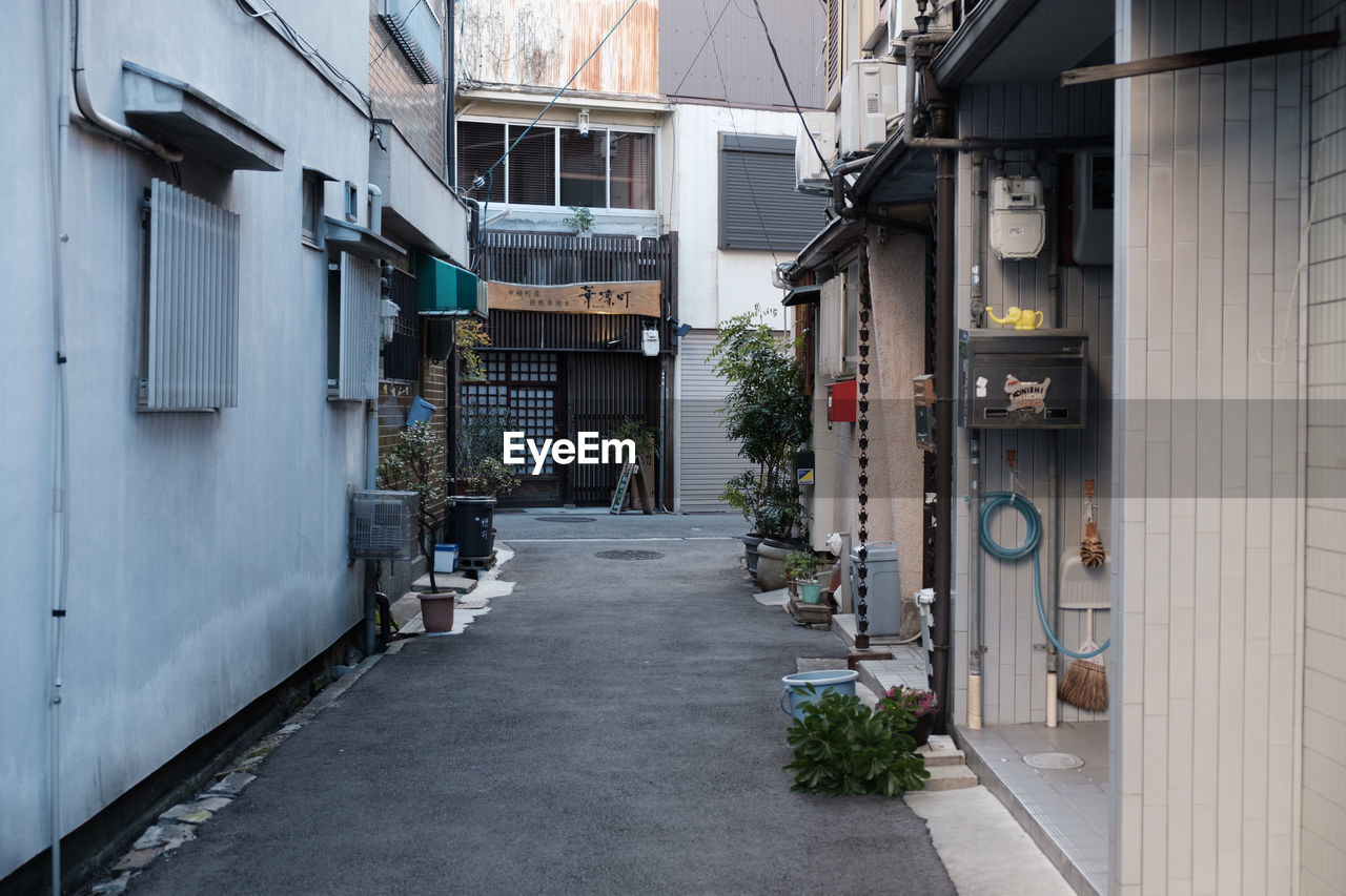 Walkway amidst buildings