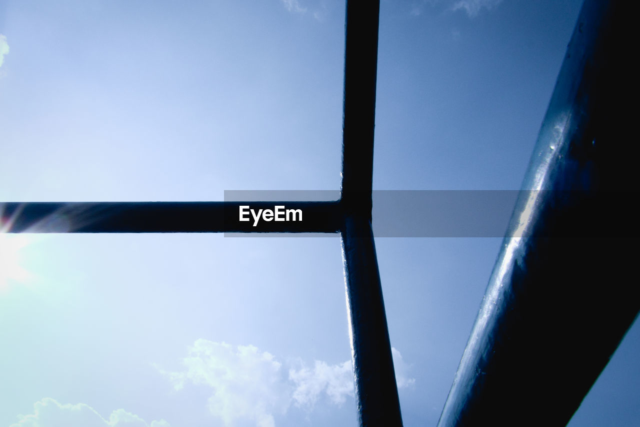 LOW ANGLE VIEW OF SKY SEEN THROUGH GLASS