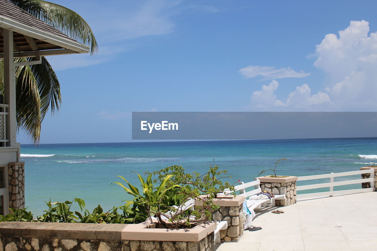 View of beach against cloudy sky