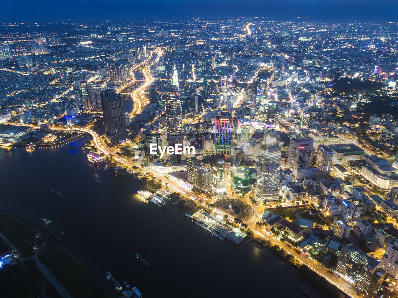 Aerial view of illuminated buildings in city at night