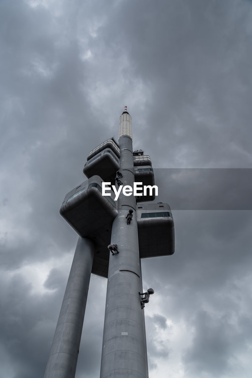 LOW ANGLE VIEW OF CROSS ON POLE AGAINST SKY