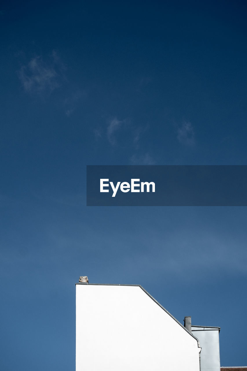 Low angle view of telephone pole against sky