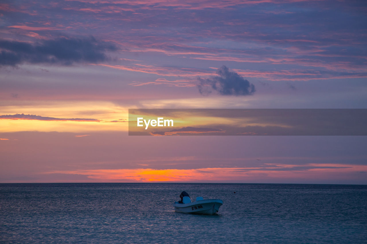 SCENIC VIEW OF SEA AGAINST ORANGE SKY