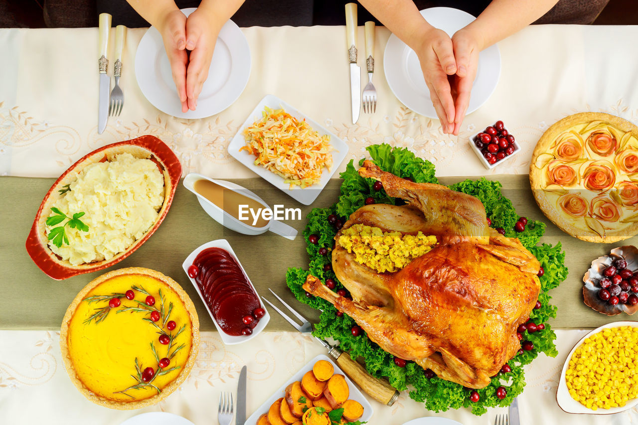 HIGH ANGLE VIEW OF PEOPLE HAVING FOOD