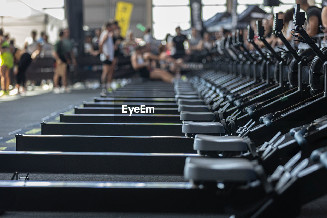 sport venue, in a row, room, gym, transportation, crowd, group of people, sports