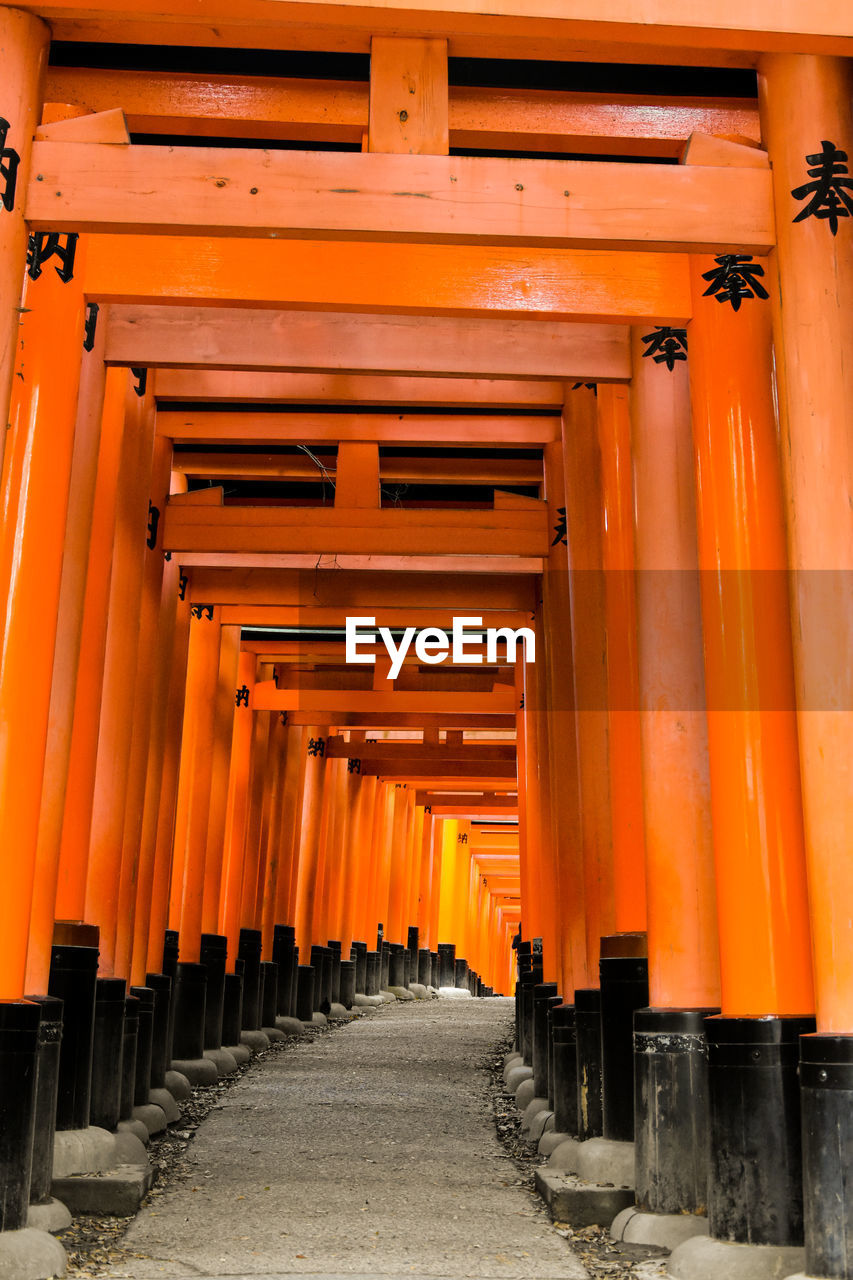 Vermillion gates at the fushimi inari shrine, kyoto, japan