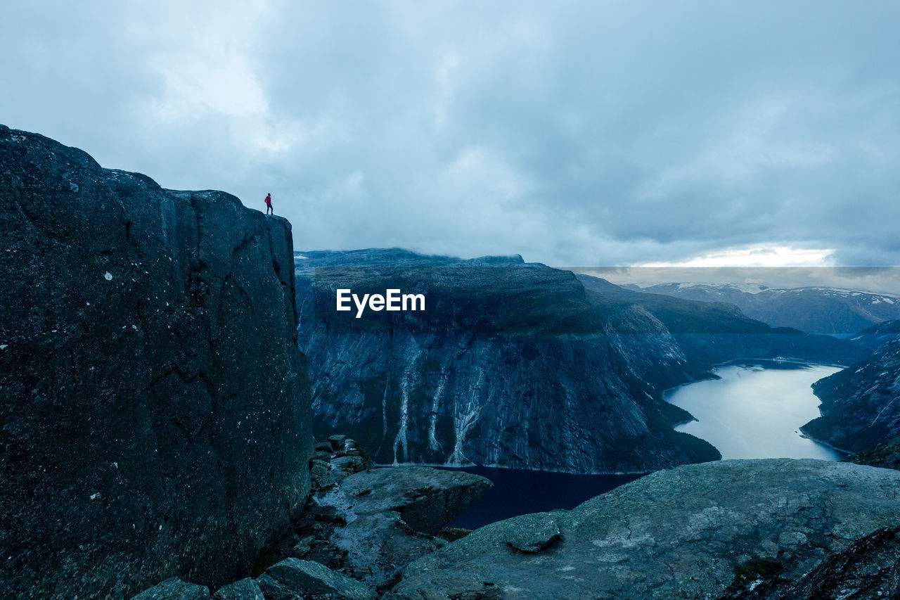 Scenic view of mountains and river against sky