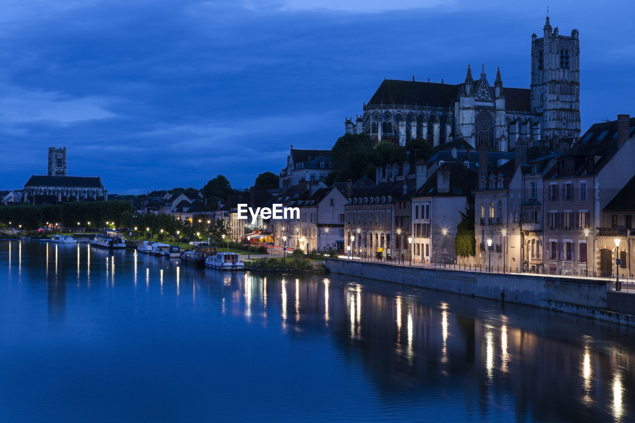 reflection of illuminated buildings in water