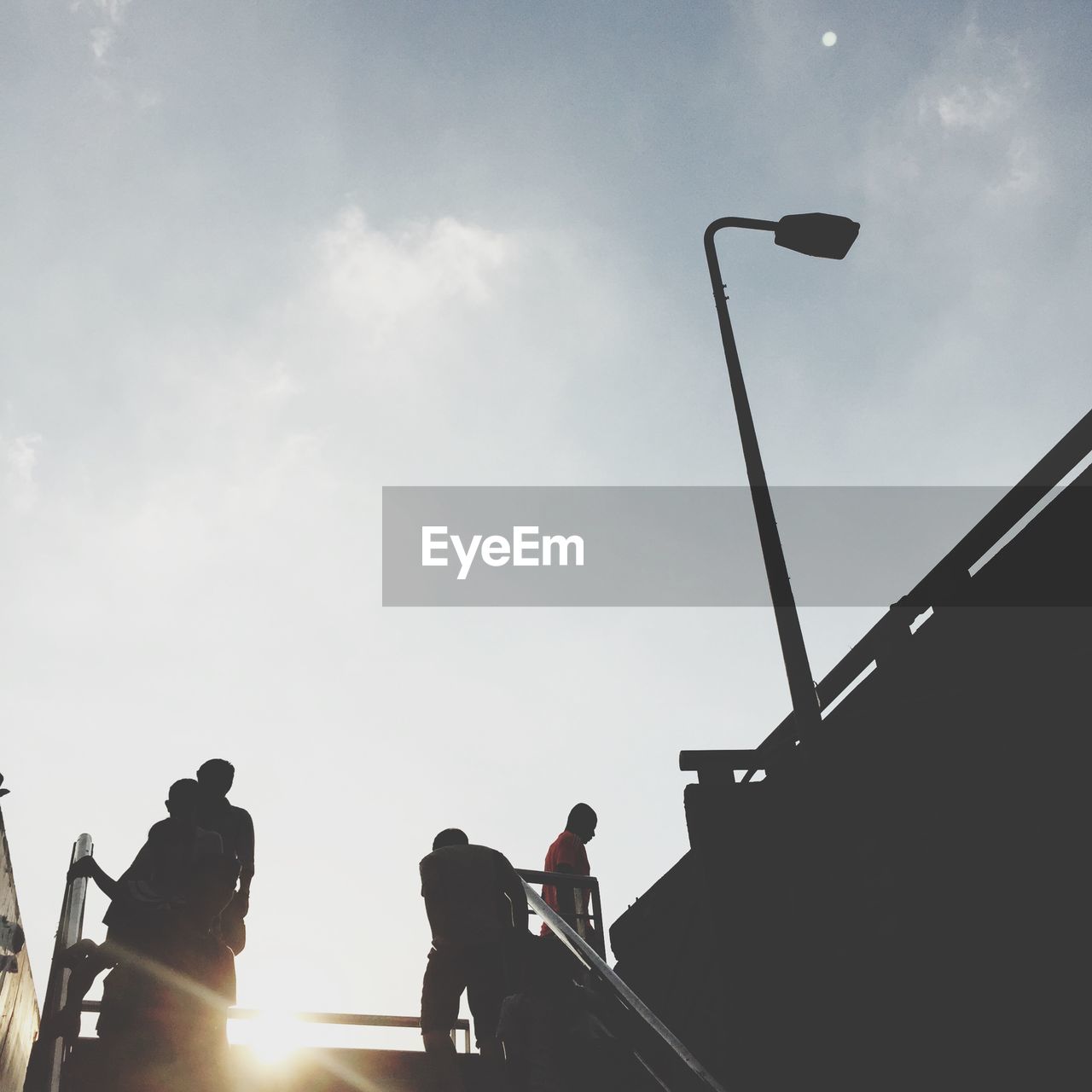 LOW ANGLE VIEW OF STREET LIGHTS AGAINST SKY