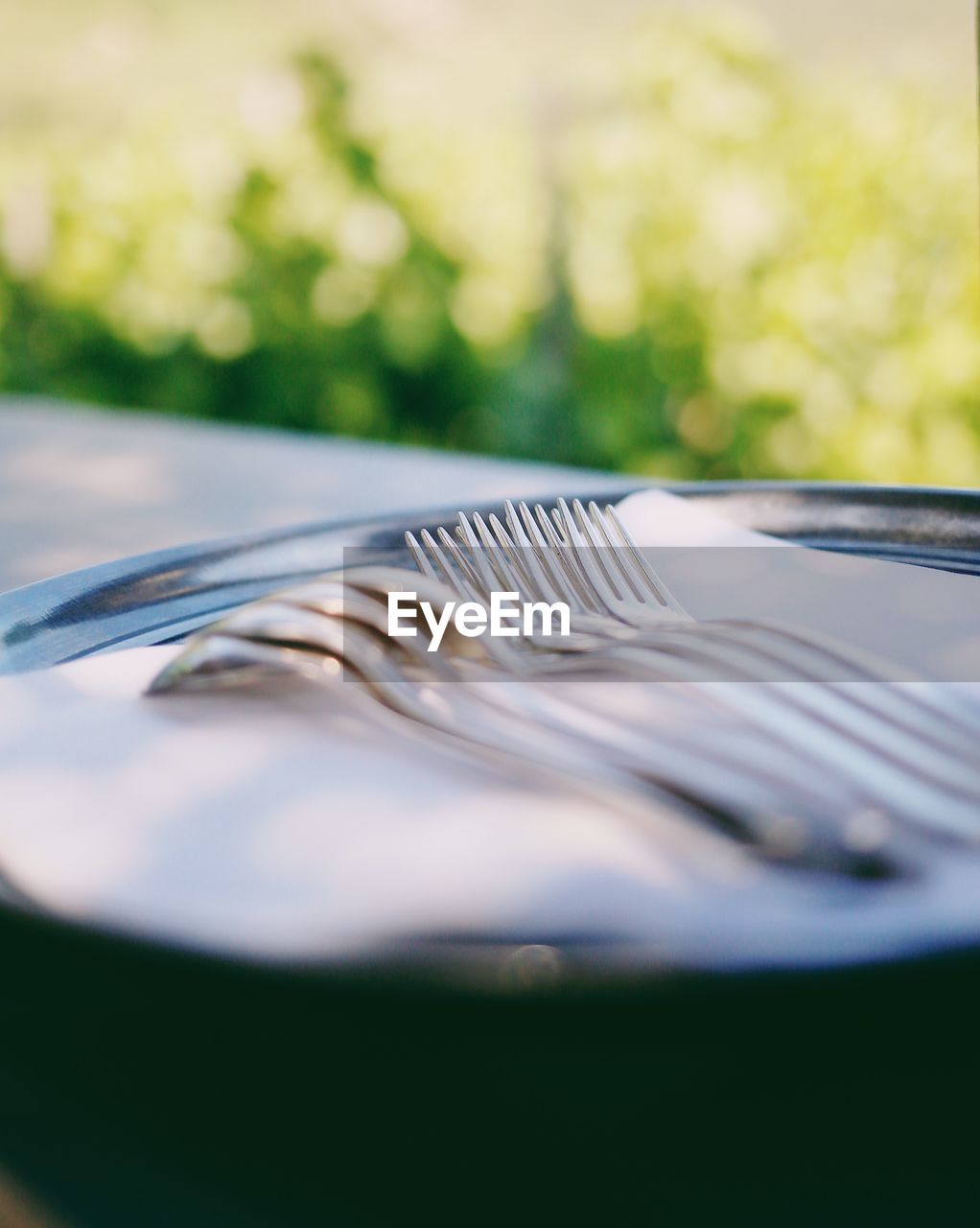 Close-up of silverware in plate on table