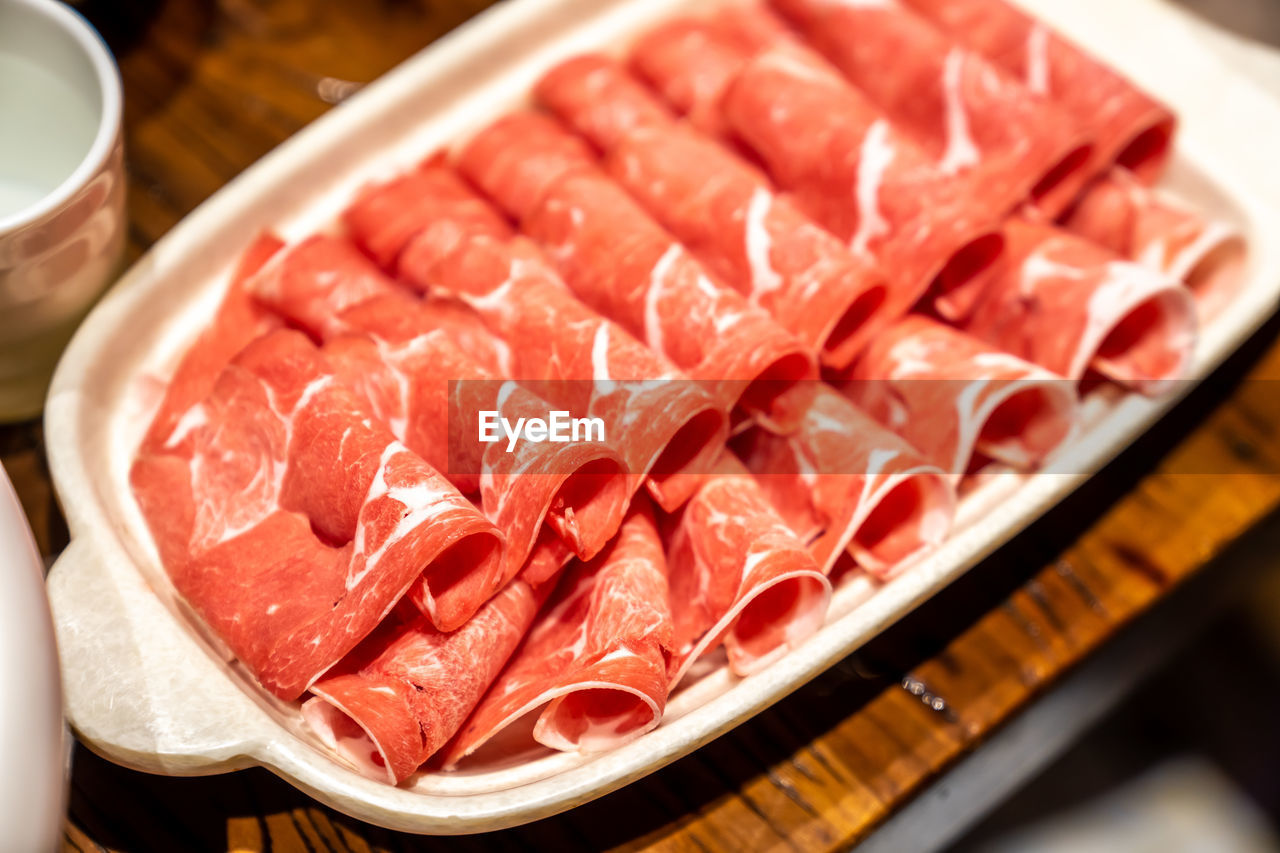 food and drink, food, meat, freshness, kobe beef, raw food, asian food, no people, dish, indoors, japanese food, pork, red meat, cuisine, close-up, healthy eating, plate, red, slice, beef, yakiniku, seafood, wellbeing, business, table, animal