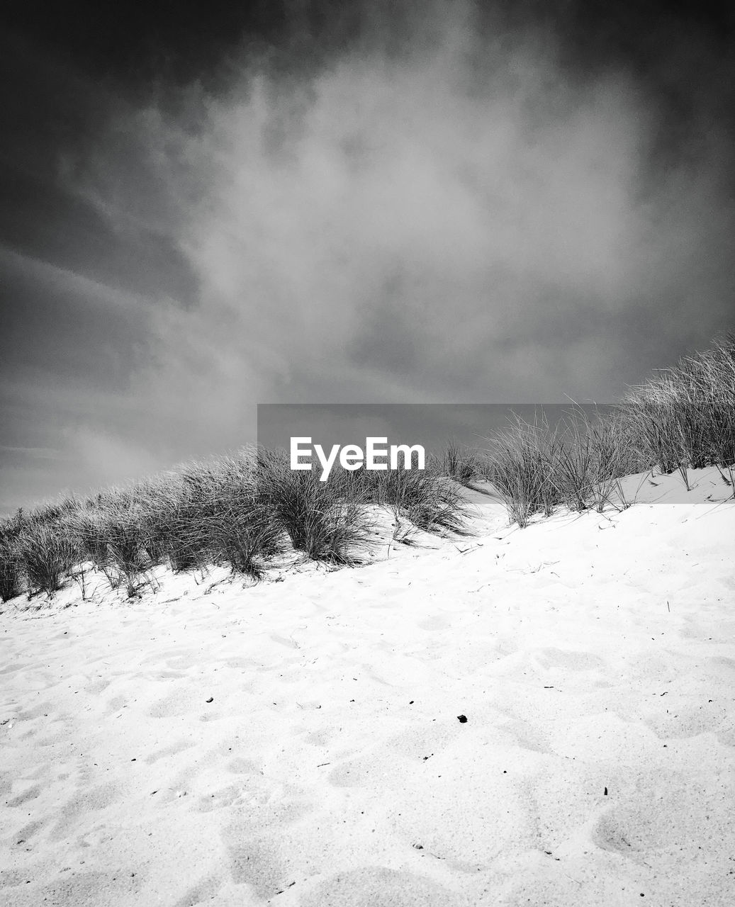 SNOW COVERED LAND AGAINST SKY