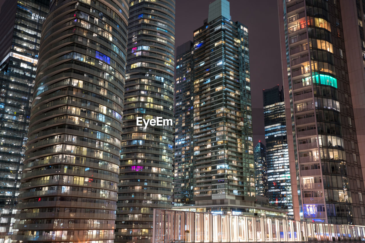 Low angle view of illuminated buildings at night