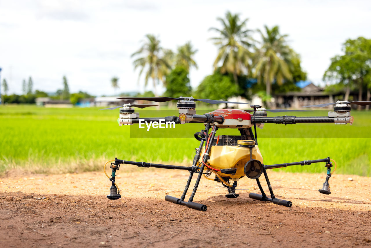 Agriculture drones fly over rice fields sprinkling fertilizer, high-resolution photographs