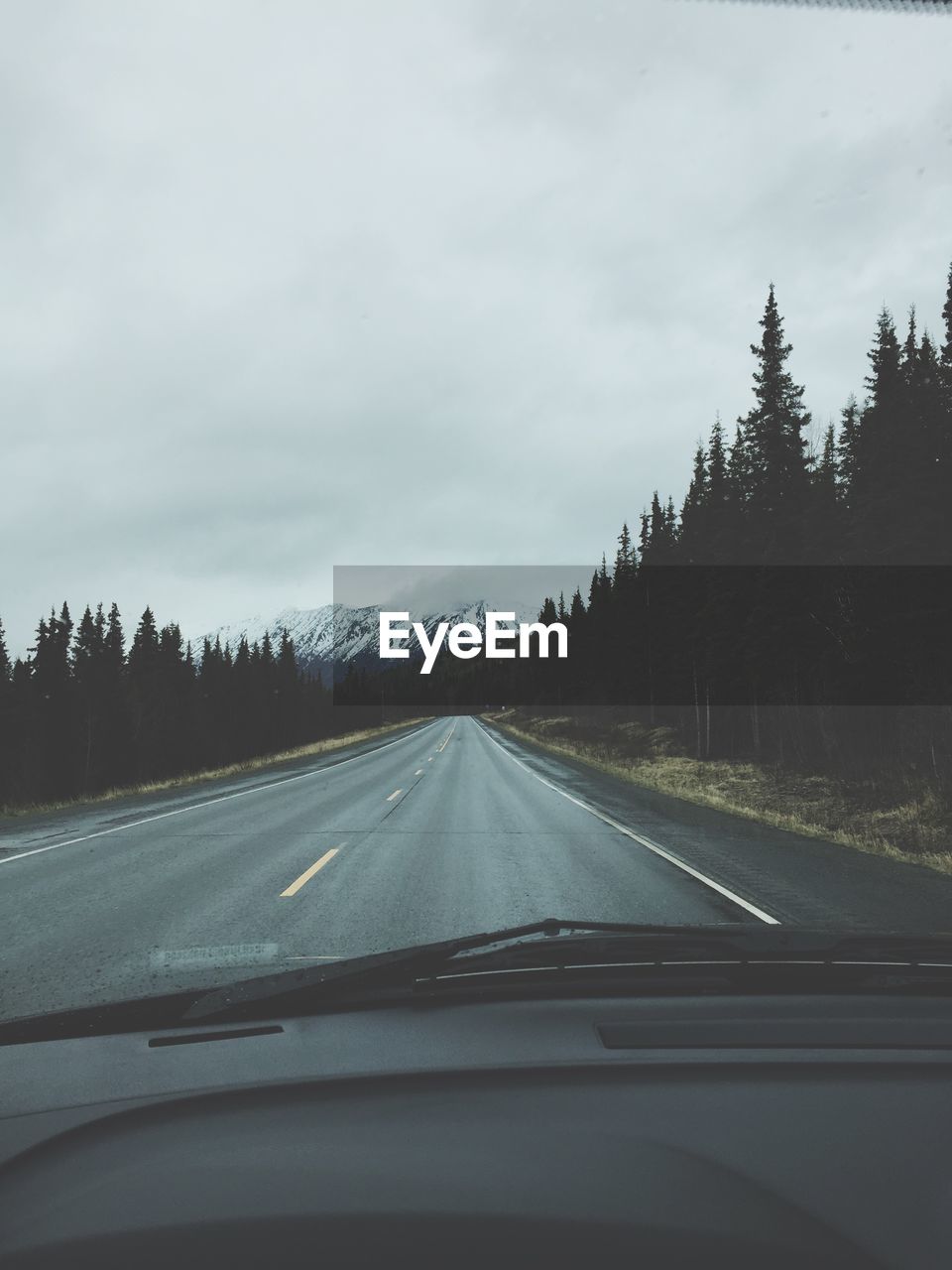 Road viewed through car windshield